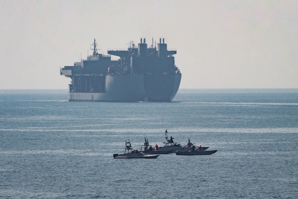 Commercial oil supertanker navigating contested international waters in the Strait of Hormuz